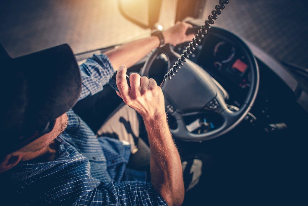truck driver using the radio to communicate